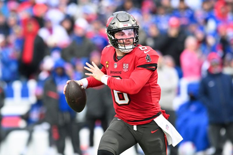 Nov 16, 2025; Orchard Park, New York, USA; Tampa Bay Buccaneers quarterback Baker Mayfield (6) scrambles against the Buffalo Bills during the second quarter of the game at Highmark Stadium. Mandatory Credit: Mark Konezny-Imagn Images
