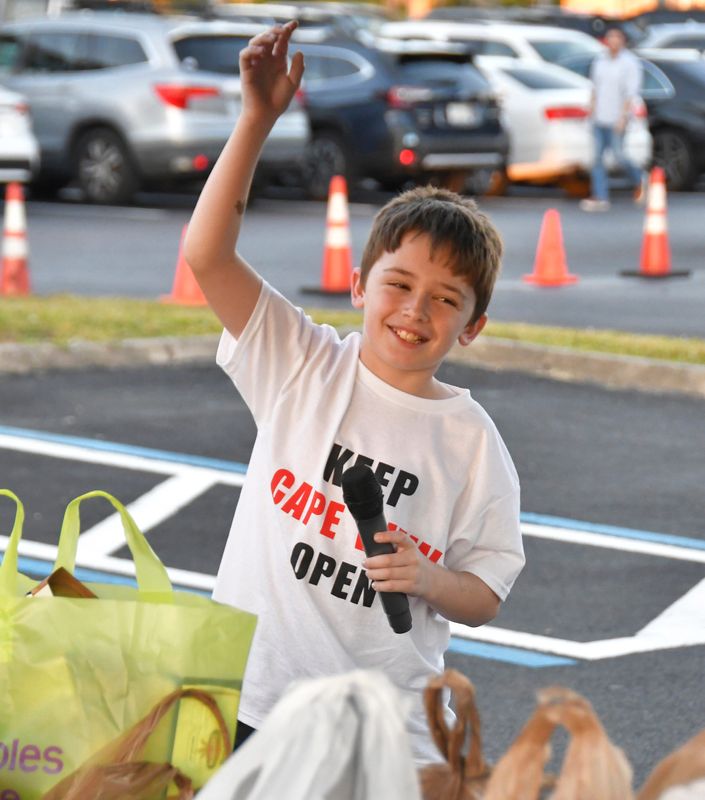 Kilian Lattig, a Cape View student, shouted words of encouragement on a microphone outside before the Nov. 18 Brevard School Board meeting, where the issue of whether Cape View Elementary should remain open was discussed.