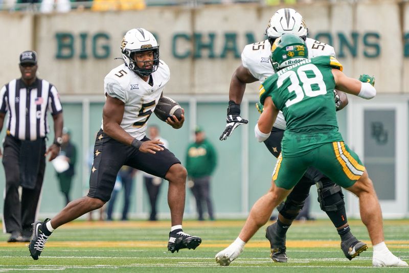 UCF Knights running back Jaden Nixon (5) carries the ball against the Baylor Bears during the second half Nov. 1, 2025 at McLane Stadium in Waco, Texas. Mandatory Credit: Raymond Car lin III-Imagn Images