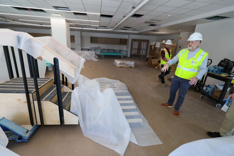 HCA North Florida COO Mark Amox looks over the physical therapy room on the rehab floor as construction continues at HCA Florida Gainesville Hospital on Nov. 21 in Gainesville. The emergency room has been up and running while construction of the 90-bed hospital connected to the ER is completed. The $231 million project is expected to be finished by May 2026.