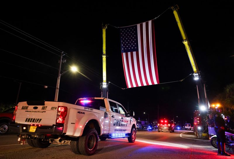 The body of 25-year veteran IRCSO Sheriff’s Deputy Terri Mashkow, 47, who died in the line of duty Nov. 21, is escorted to the medical examiner's office along S. 35th Street, Nov. 21, 2025, in Fort Pierce.