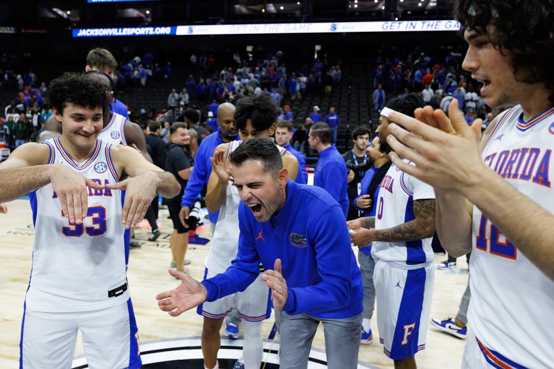 Nov 16, 2025; Jacksonville, Florida, USA; Florida Gators head coach Todd Golden celebrates with Florida Gators guard Cooper Josefsberg (33) and his team against the Miami Hurricanes during the second half at VyStar Veterans Memorial Arena. Mandatory Credit: Matt Pendleton-Imagn Images