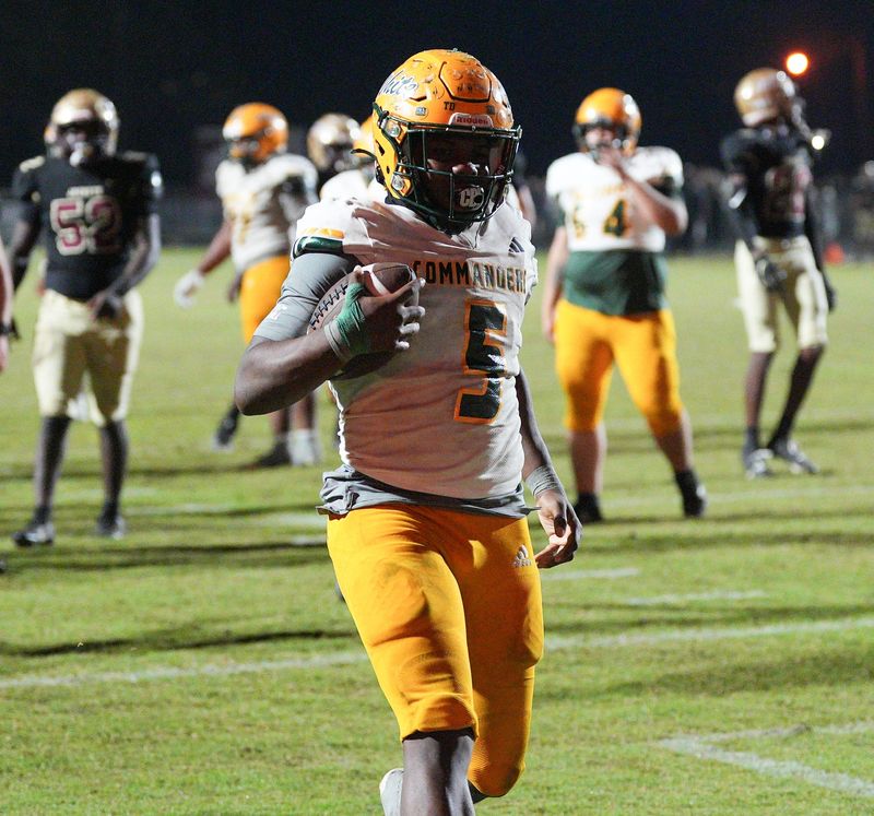 Ed White Commanders running back Rontrez Loyd (5) runs into the end zone for a touchdown against St. Augustine.