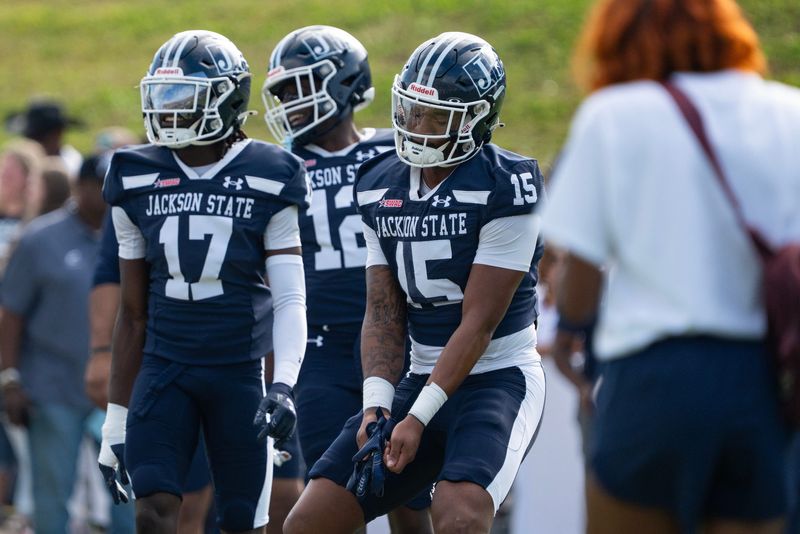 Jackson State's defensive back Kam Sallis (15) dances to "Tootsee Roll" by 69 Boyz during warmups before the game against Alcorn State in Jackson, Miss., on Saturday, Nov. 22, 2025.