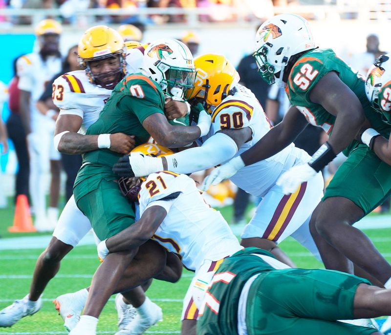 Florida A&M's Thad Franklin Jr. (0) is stopped at the line of scrimmage by Bethune-Cookman during the Florida Classic, Saturday, Nov. 22, 2025, at Camping World Stadium in Orlando.
