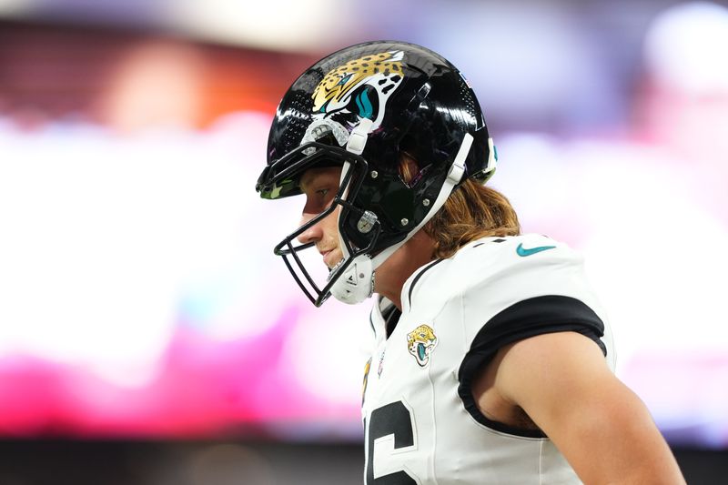 Nov 23, 2025; Glendale, Arizona, USA; Jacksonville Jaguars quarterback Trevor Lawrence (16) looks on during the first quarter against the Arizona Cardinals at State Farm Stadium. Mandatory Credit: Joe Camporeale-Imagn Images