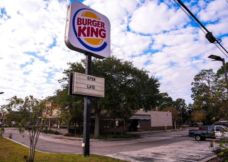 A man pressure washes outside the Burger King at 7900 Blanding Blvd. in Jacksonville, Fla. Monday morning, November 24, 2025. A shooting occurred at the Burger King Saturday November 22, 2025. Matthew Jackson died, and another man was hospitalized with non-life-threatening injuries but is expected to recover, according to the Sheriff's Office. Dawud Burritt, 28, faces multiple charges, including murder, in the shootings. [Doug Engle/Florida Times-Union]
