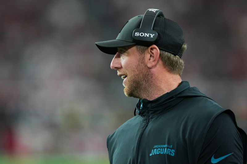 Nov 23, 2025; Glendale, Arizona, USA; Jacksonville Jaguars head coach Liam Coen looks on during the third quarter against the Arizona Cardinals at State Farm Stadium. Mandatory Credit: Joe Camporeale-Imagn Images