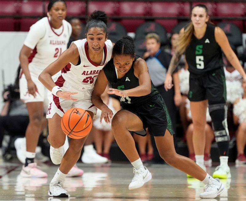Stetson guard Cameron Thomas (21) battles Alabama guard Diana Collins (20) for the ball during a season-opening game at Coleman Coliseum on Nov 3, 2025.