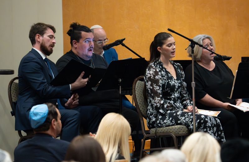 A chorus made up of members from Temple Emanu-EL of Palm Beach, Basilica of St. Edward, The Church of Bethesda-by-the-Sea, and The Royal Poinciana Chapel, sing during the Interfaith Thanksgiving Service at Temple Emanu-EL on Nov. 26.