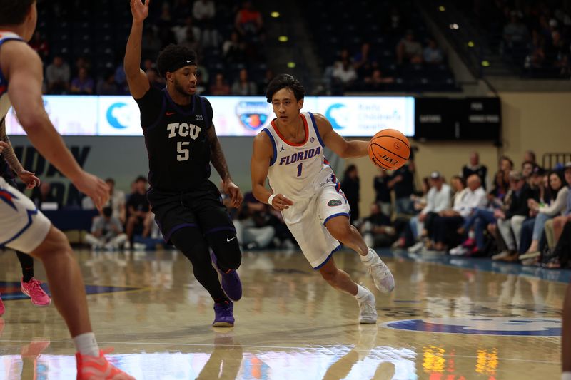 Nov 27, 2025; San Diego, California, USA; Florida Gators guard Xaivian Lee (1) drives the ball against Texas Christian University Horned Frogs during the second half at Jenny Craig Pavilion. Mandatory Credit: Abe Arredondo-Imagn Images