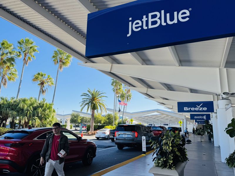 A sign for JetBlue in front of Daytona Beach International Airport on Friday, Nov. 28, 2025. The airline is returning after a seven-year hiatus Thursday, Dec. 4, to offer daily nonstop flights to Daytona Beach from New York City (JFK International) and from Boston.