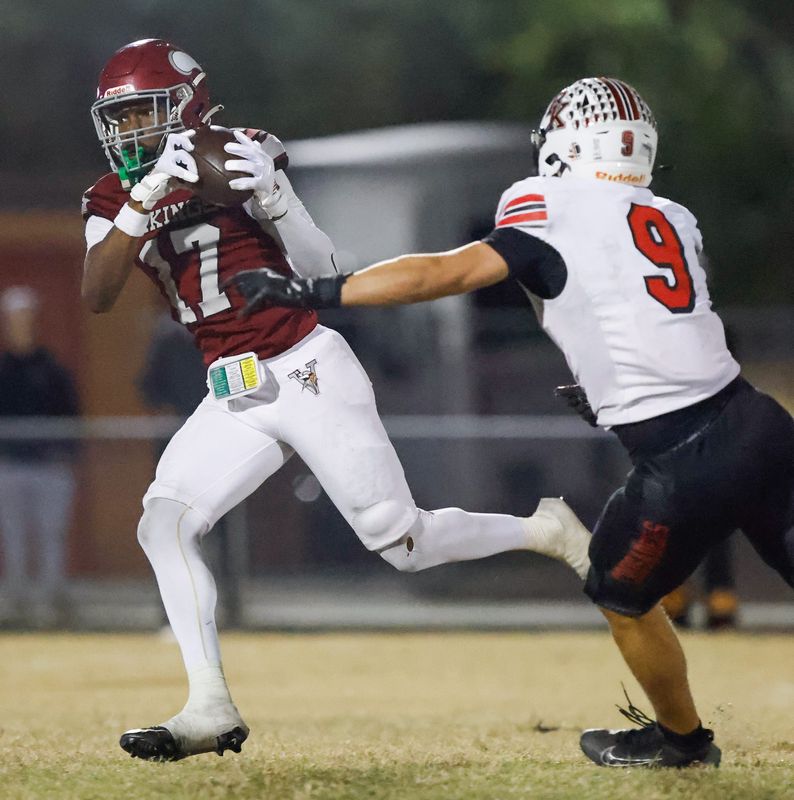 Raines High School wide receiver Kiran Jackson (17) hauls in a pass against Bishop Kenny in a November 2025 game. The Vikings are attempting to repeat their 2025 state championship.