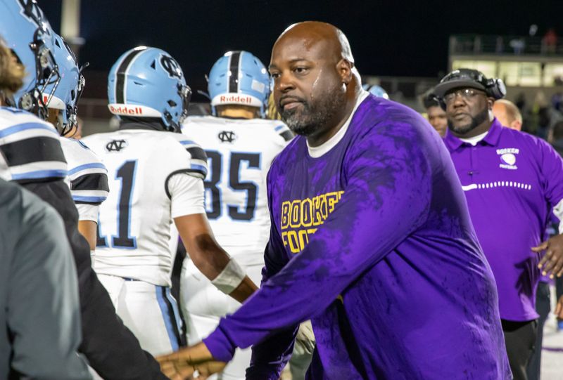 Booker won the Class 3A-Region 3 football title over Nature Coast 50-14 on Friday, Nov. 28, 2025. Booker head coach Carlos Woods was given an ice-water bath after the final second ticked off.