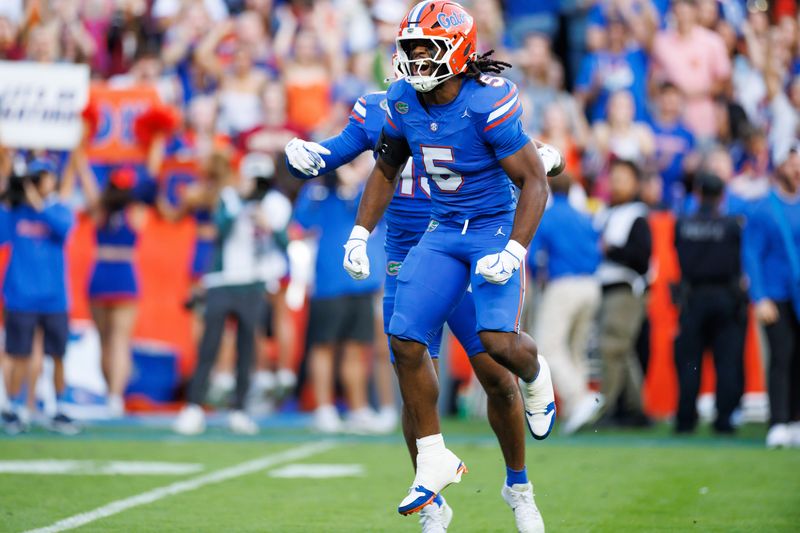 Nov 29, 2025; Gainesville, Florida, USA; Florida Gators linebacker Myles Graham (5) reacts after a sack against the Florida State Seminoles during the first half at Ben Hill Griffin Stadium. Mandatory Credit: Matt Pendleton-Imagn Images