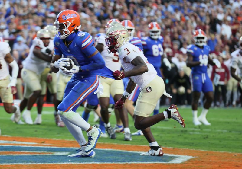 Florida wide receiver J. Michael Sturdivant (9) scores during the first half of an NCAA football game at Steve Spurrier Field at Ben Hill Griffin Stadium in Gainesville, FL on Saturday, November 29, 2025. [Alan Youngblood/Gainesville Sun]