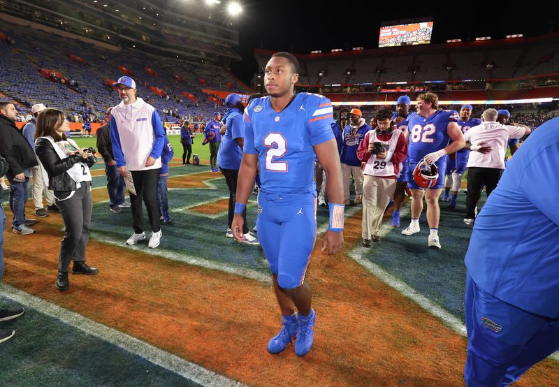Florida quarterback DJ Lagway (2) leaves the field after beating Florida State 40-21 during an NCAA football game at Steve Spurrier Field at Ben Hill Griffin Stadium in Gainesville, FL on Saturday, November 29, Florida beat Florida State 40-21.2025. [Alan Youngblood/Gainesville Sun]
