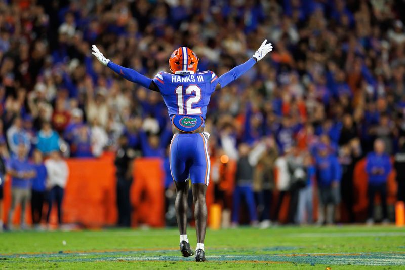 Nov 29, 2025; Gainesville, Florida, USA; Florida Gators defensive back Ben Hanks III (12) reacts after a stop against the Florida State Seminoles during the second half at Ben Hill Griffin Stadium. Mandatory Credit: Matt Pendleton-Imagn Images
