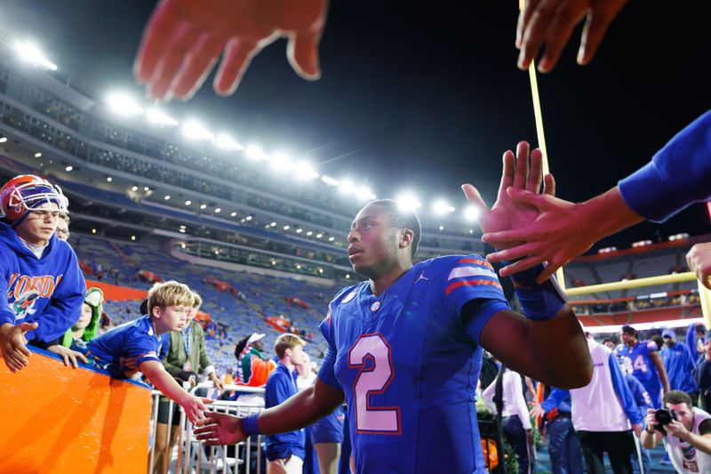 Nov 29, 2025; Gainesville, Florida, USA; Florida Gators quarterback DJ Lagway (2) leaves the field after a game against the Florida State Seminoles at Ben Hill Griffin Stadium. Mandatory Credit: Matt Pendleton-Imagn Images
