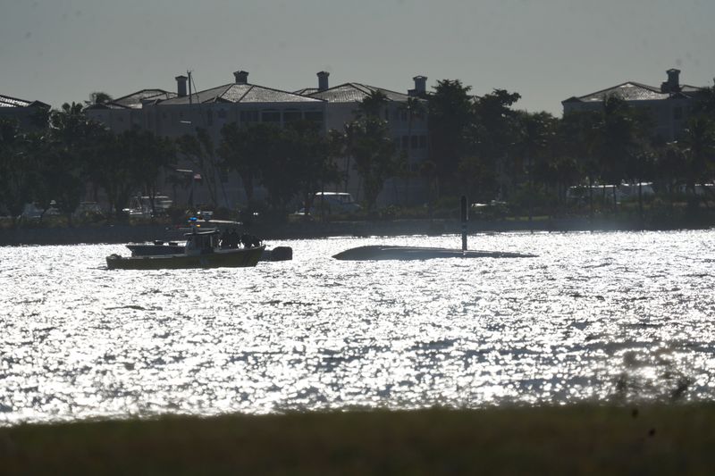 Emergency Officials work the scene of boat crash in the Caloosahatchee River on Sunday, Nov. 30, 2025.