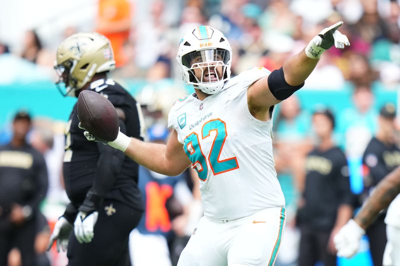 Nov 30, 2025; Miami Gardens, Florida, USA; Miami Dolphins defensive tackle Zach Sieler (92) reacts after forcing a fumble against the New Orleans Saints during the first half at Hard Rock Stadium. Mandatory Credit: Rich Storry-Imagn Images