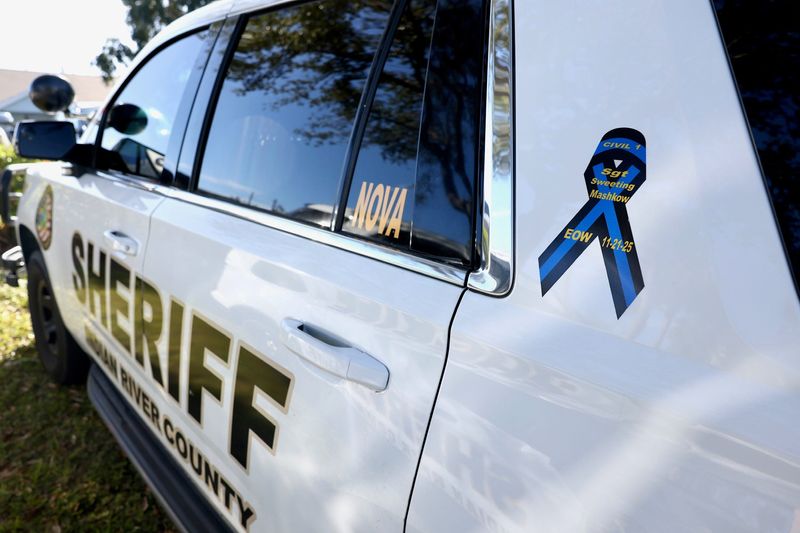 An end of watch ribbon for Sgt. Terri Sweeting-Mashkow is displayed Dec. 1, 2025, on an Indian River County Sheriff's Office vehicle parked in front of Thomas S. Lowther Funeral Home and Crematory in Vero Beach, Florida.