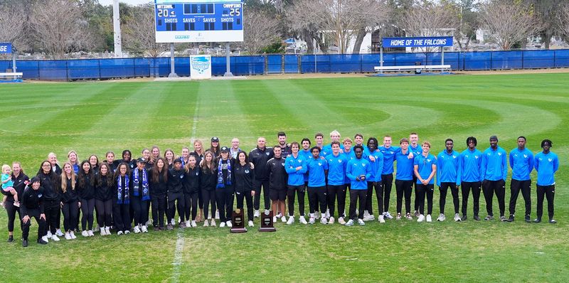 Daytona State's women's soccer team and men's soccer team pose together for a group photo during the trophy celebration at Daytona State College, Monday, Dec. 1, 2025. The women's soccer team won the 2025 NJCAA Division I championship, the program's second straight title, while the men's soccer team finished as the national runner-up.