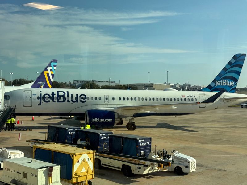 An arriving JetBlue jetliner from New York City docks at Gate 4 at Daytona Beach International Airport on Thursday morning, Dec. 4, 2025. It marked the airline's return after a seven-year hiatus. JetBlue now offers daily nonstop service to New York and Boston.