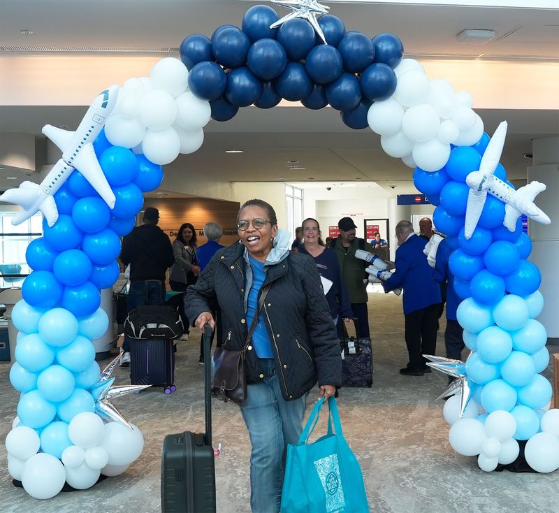 Passengers are welcomed to Daytona Beach after arriving on JetBlue’s inaugural nonstop flight from New York to Daytona Beach International Airport on Thursday, Dec. 4, 2025.