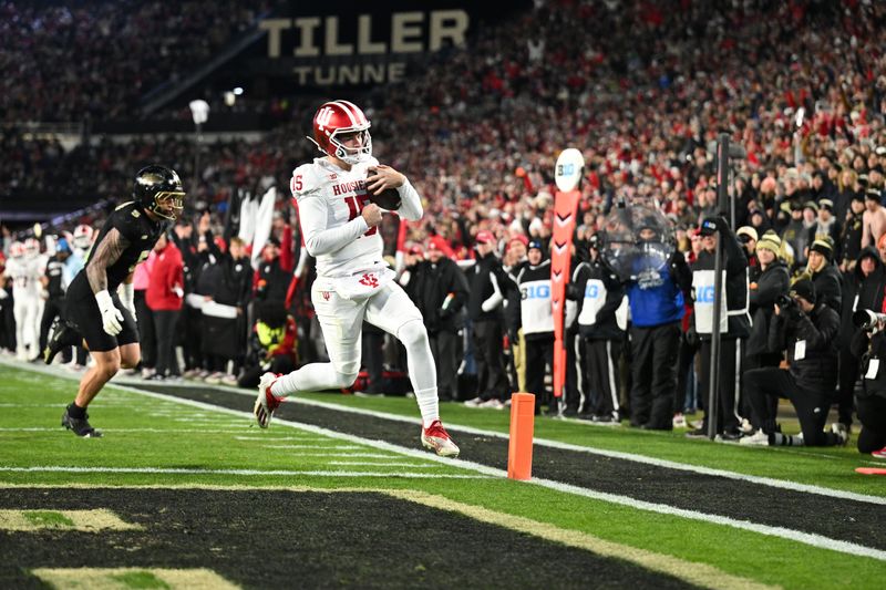 Nov 28, 2025; West Lafayette, Indiana, USA; Indiana Hoosiers quarterback Fernando Mendoza (15) rushes for a touchdown during the second quarter against the Purdue Boilermakers at Ross-Ade Stadium. Mandatory Credit: Marc Lebryk-Imagn Images