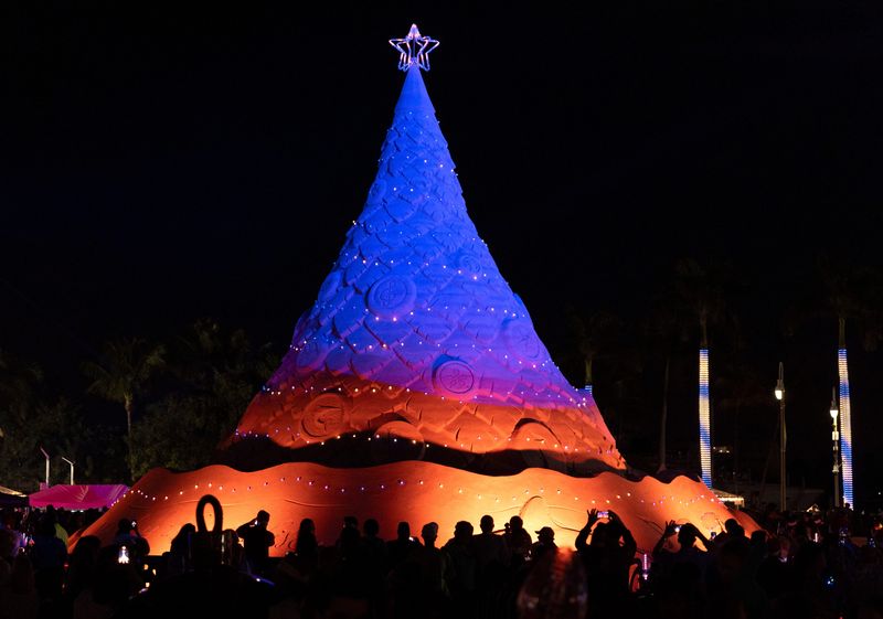 Sandi, the world's only 35-foot-tall, 700-ton holiday sand tree lighting for 2025 Holiday in Paradise on December 4, 2025, in West Palm Beach, Florida.