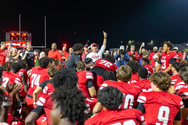 Vero Beach head coach Lenny Jankowski celebrates with his team after winning the high school football 7A State Semifinal against Palmetto on Dec. 5, 2025, in Vero Beach. Vero Beach won 45-44, and advances to the State Final for the first time since 1981.