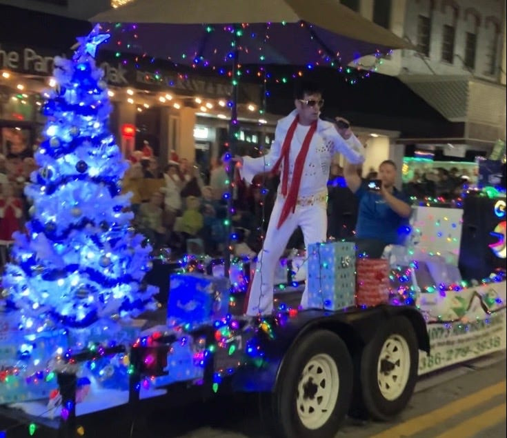 An Elvis impersonator entertains the crowd during the DeLand Christmas Parade on Dec. 6, 2025.