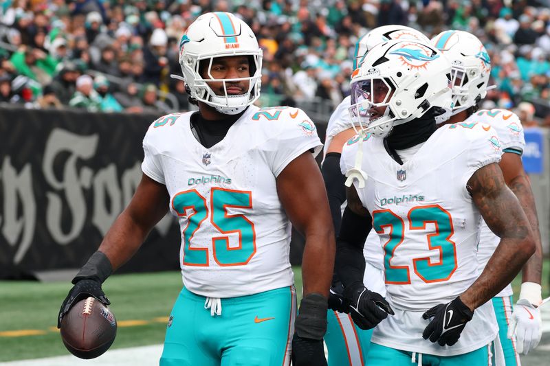 Dec 7, 2025; East Rutherford, New Jersey, USA; Miami Dolphins linebacker Tyrel Dodson (25) celebrates after making an interception against the New York Jets during the first half at MetLife Stadium. Mandatory Credit: Ed Mulholland-Imagn Images