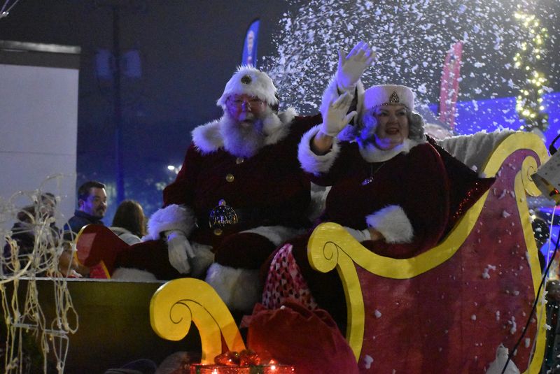 Santa and Mrs. Claus wave to the crowd.