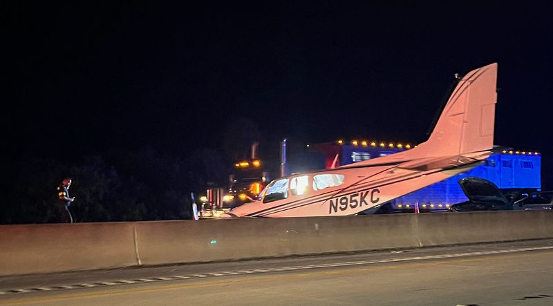 A small plane crash-landed on southbound Interstate 95 just south of State Road 520 during the evening rush hour on Monday, Dec. 8. In this picture taken from the northbound lanes, a semi passing by is pictured in the background.