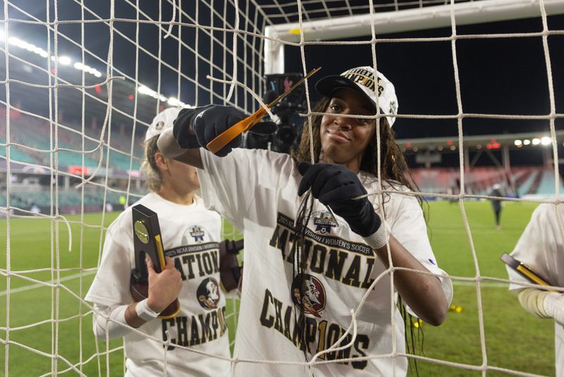 Dec 8, 2025; Kansas City, MO, USA; Florida State Seminoles forward Jordynn Dydley cuts the net after her team’s 1-0 win over Stanford in the 2025 NCAA Women’s College Cup Championship at CPKC Stadium.