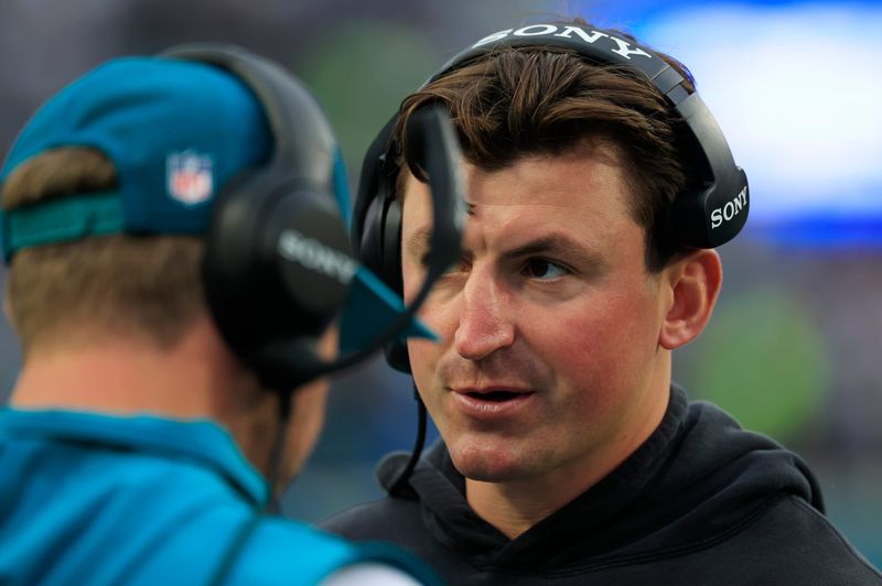 Jacksonville Jaguars offensive coordinator Grant Udinski looks on during the first quarter of an NFL football game at EverBank Stadium, Sunday, Dec. 7, 2025, in Jacksonville, Fla. The Jaguars defeated the Colts 36-19.