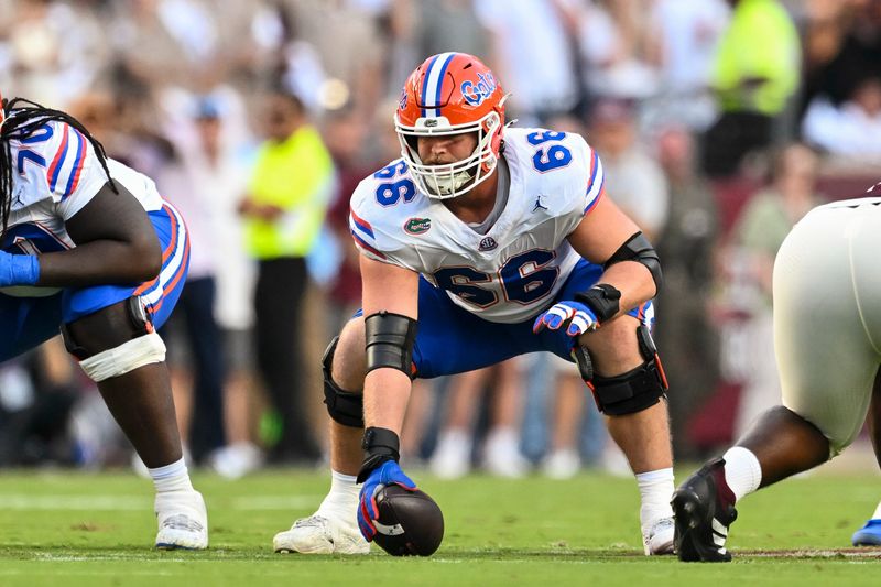 Oct 11, 2025; College Station, Texas, USA; Florida Gators offensive lineman Jake Slaughter (66) sets the ball during the first half against the Texas A&M Aggies at Kyle Field. Mandatory Credit: Maria Lysaker-Imagn Images