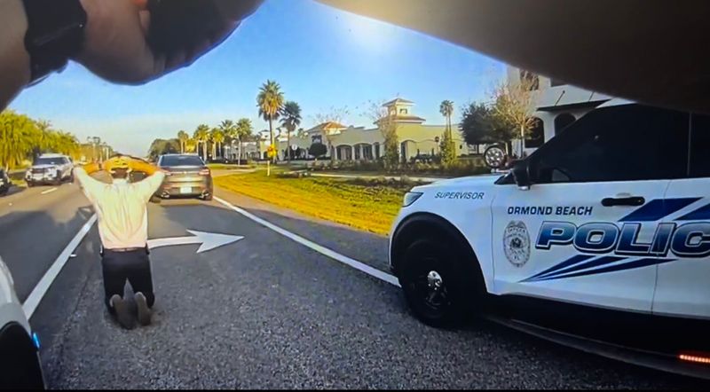 Ormond Beach Police Sgt. Caleb Braun arrests Flagler County Sheriff's Office Detective Ardit Coma on Dec. 4, 2025 in this still frame from a body camera video.