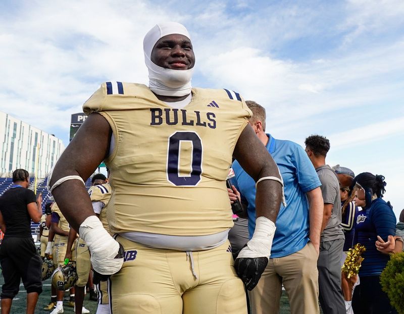 West Boca defensive tackle Jamar Thompson (0) waits in line for his medal after a victory over West Broward in the 6A State Final at Pitbull Stadium on Dec. 12, 2025, in Miami, FL.