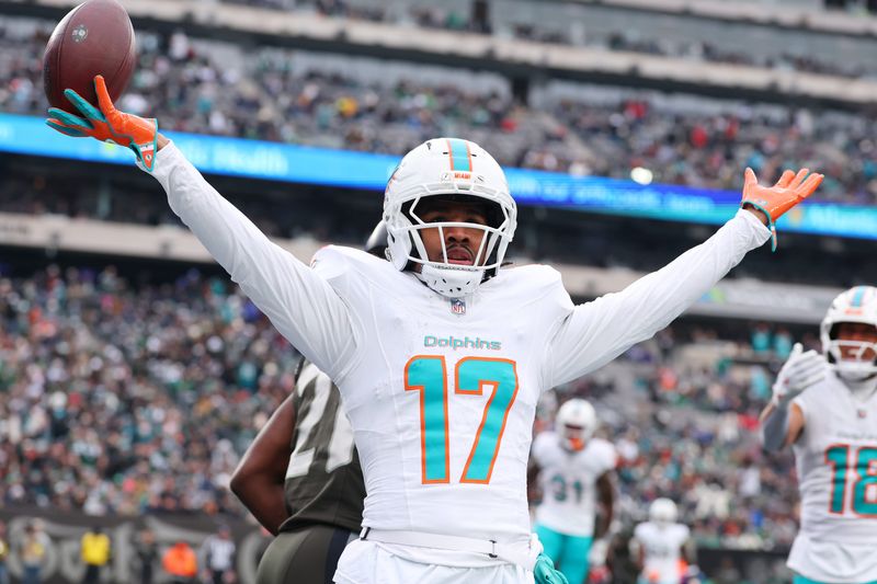 Miami Dolphins wide receiver Jaylen Waddle (17) reacts after making a catch Dec. 7, 2025 for a touchdown against the New York Jets during the first half at MetLife Stadium in East Rutherford, New Jersey. Mandatory Credit: Ed Mulholland-Imagn Images