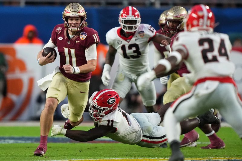 Dec 30, 2023; Miami Gardens, FL, USA; Florida State Seminoles quarterback Brock Glenn (11) runs with the ball against the Georgia Bulldogs during the second half in the 2023 Orange Bowl at Hard Rock Stadium. Mandatory Credit: Jasen Vinlove-USA TODAY Sports