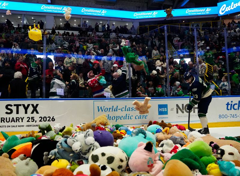 Teddy bears and stuffed animals rain down on the ice at Hertz Arena after the Florida Everblades scored a goal on Friday, Dec. 12, 2025. The Annual Teddy Bear Toss benefits children at Lee Health Golisano Children’s Hospital.
