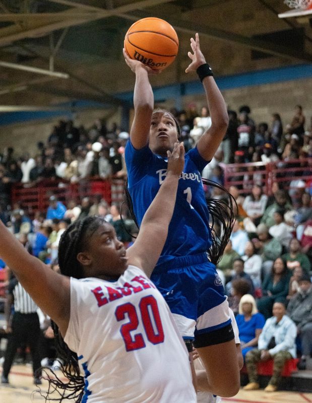 Booker T. Washington's Jada Clardy (1) shoots against the Eagles during the Booker vs Pine Forest girls basketball game at Pine Forest High School in Pensacola on Dec. 12, 2025.