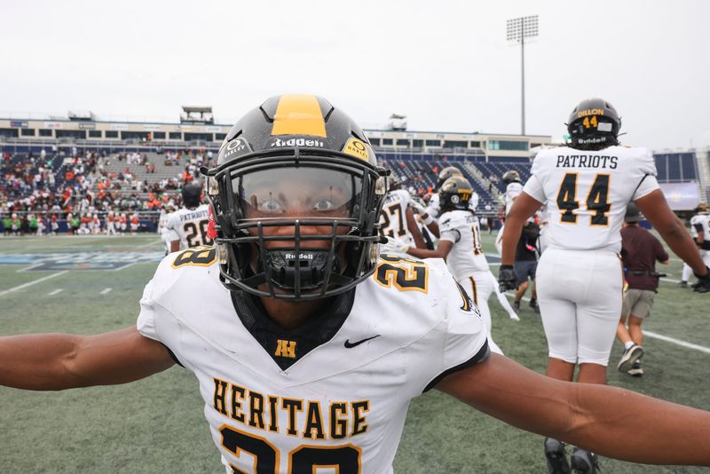 American Heritage celebrates winning the FHSAA 4A state championship against Jones, Dec. 13, 2025, at Pitbull Stadium in Miami. American Heritage won 33-28.