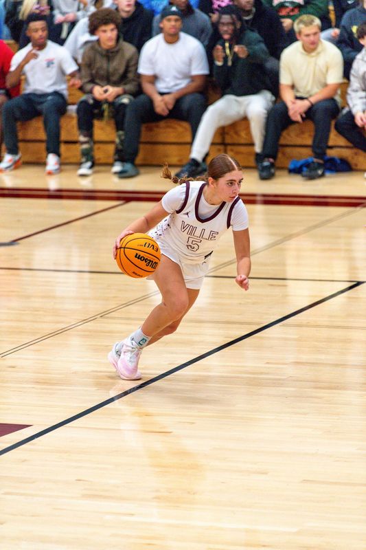 Niceville senior Audrina Nelson takes the ball up the court in a game earlier this season.