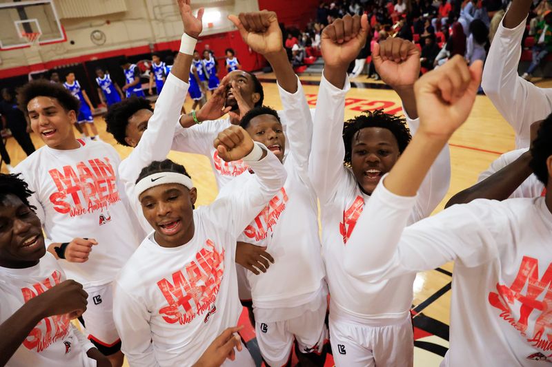 Jackson players break after a huddle before a boys basketball matchup against Impact Christian.
