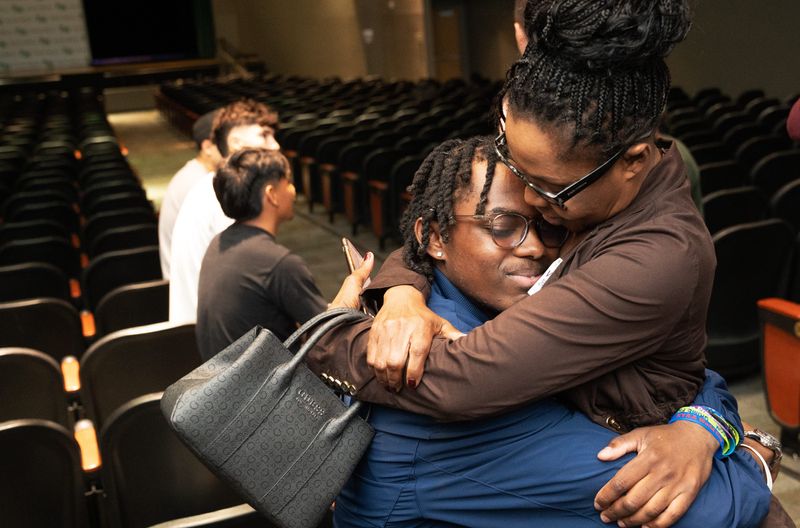 Fort Myers High School alum and current Georgia Southern soccer player Ricky Louis hugs his mother, Carmelle after he was drafted as the 2nd overall pick to FC Dallas in the MLS SuperDraft on Thursday, Dec. 18, 2025. He gathered with family, friends, and former teammates in the auditorium at Fort Myers High School.