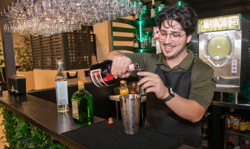 Tocayos Mexican Restaurant's co-owner, Javier Barragan, creates one of the restaurant's signature Margaritas for a customer on Dec. 18, 2025. Customers familiar with the family's past restaurant ventures will take delight in the return of several food favorites and a few new ones, too.